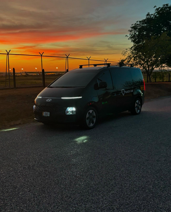 Black Car CR passenger van at sunset