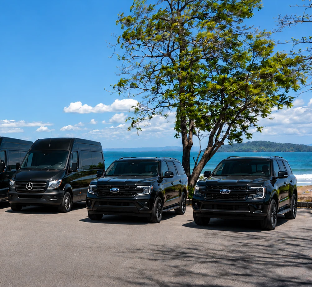 Black Car CR fleet lined up in front of the beach in Costa Rica